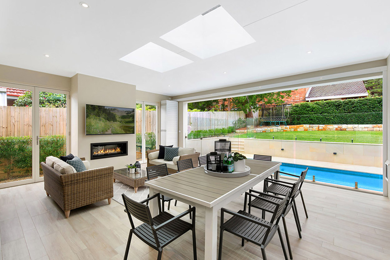 Outdoor dining set next to pool