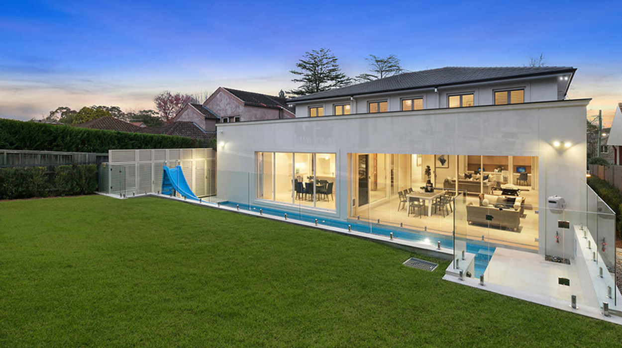 Backyard view of grass and pool