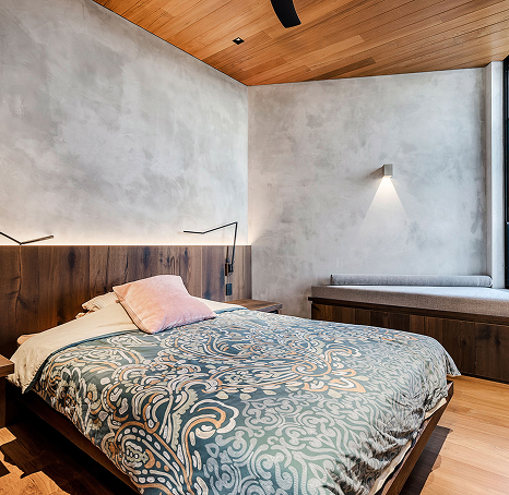 Bedroom, with polished concrete walls and wooden ceilings
