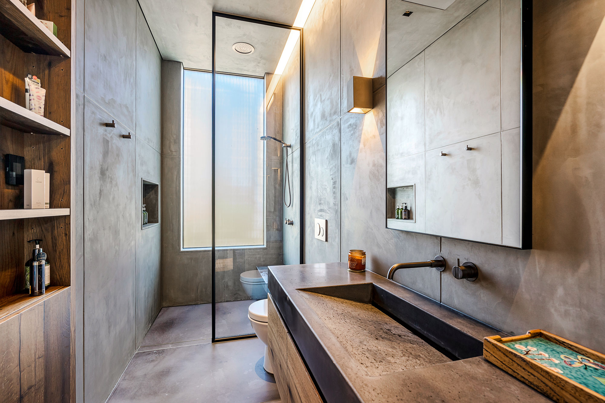 Modern concrete-forward bathroom