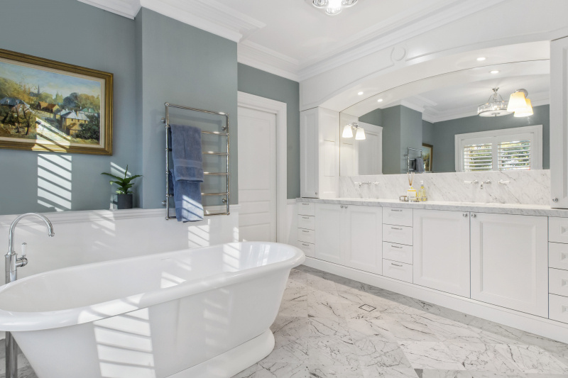 Shot of French Provincial style bathroom, with marble, powder blue walls