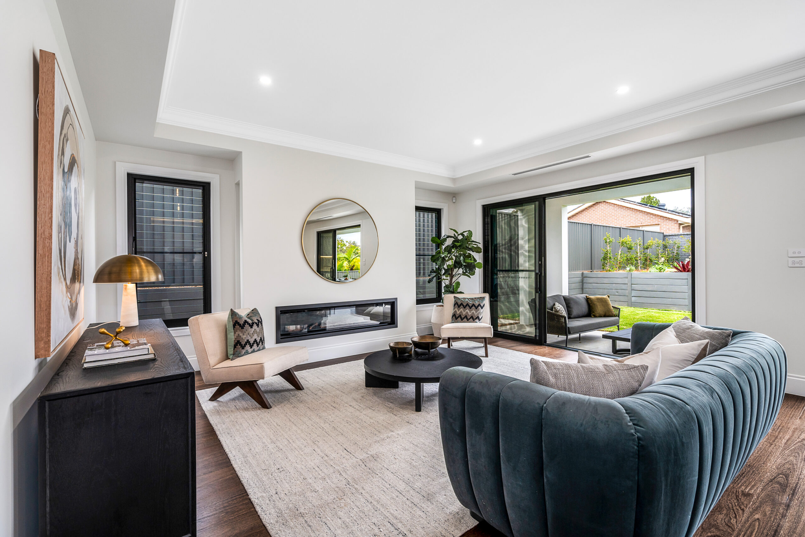Neo Classical living room, with muted creams against velvet couch and premium copper finishes