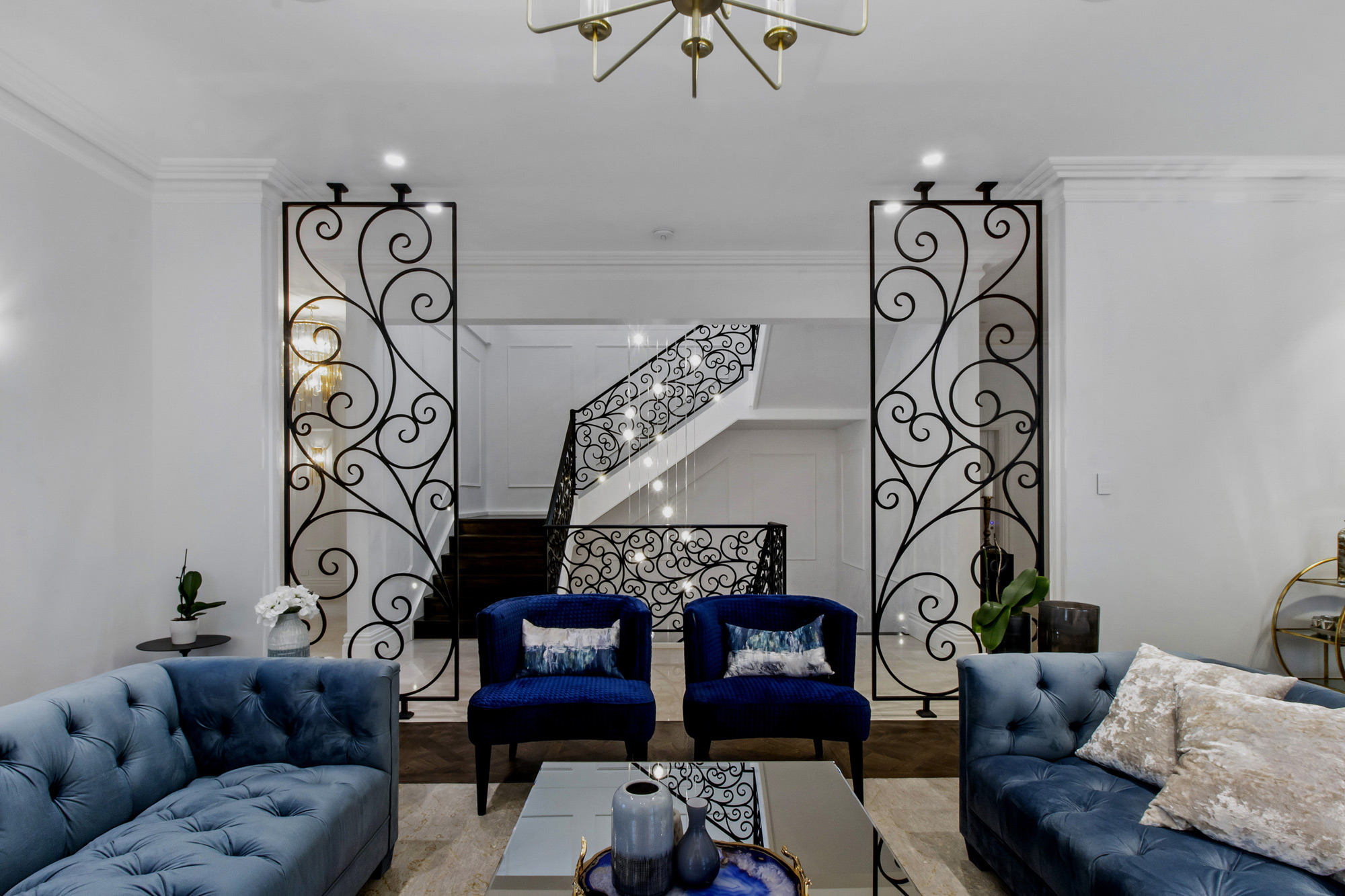 Oatlands Neo-Classical: seating area with view to wrought iron staircases