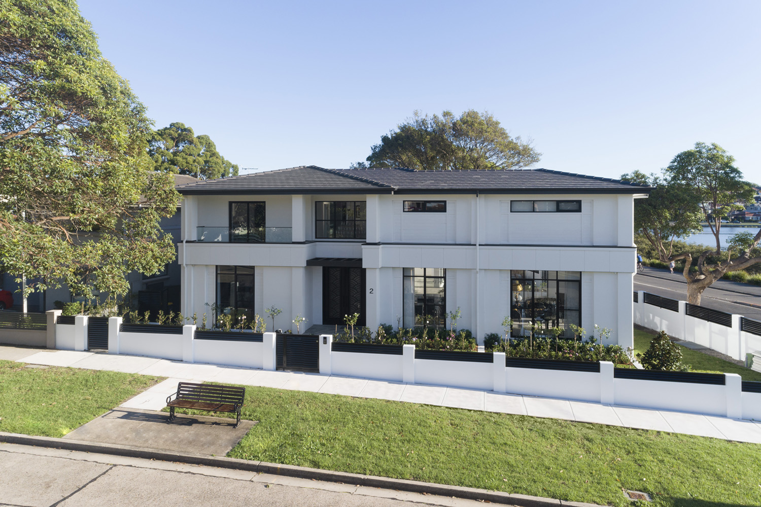 Rodd Point Contemporary: elevated view of home from the street
