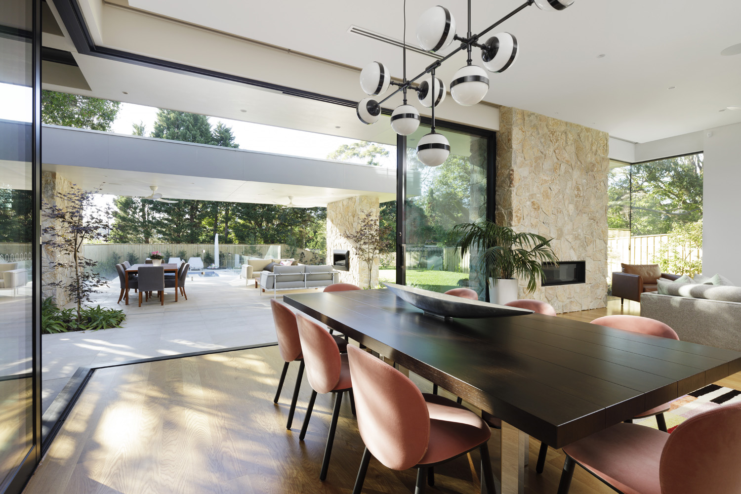 Seaforth Modern: dining area with view through floor to ceiling glass doors