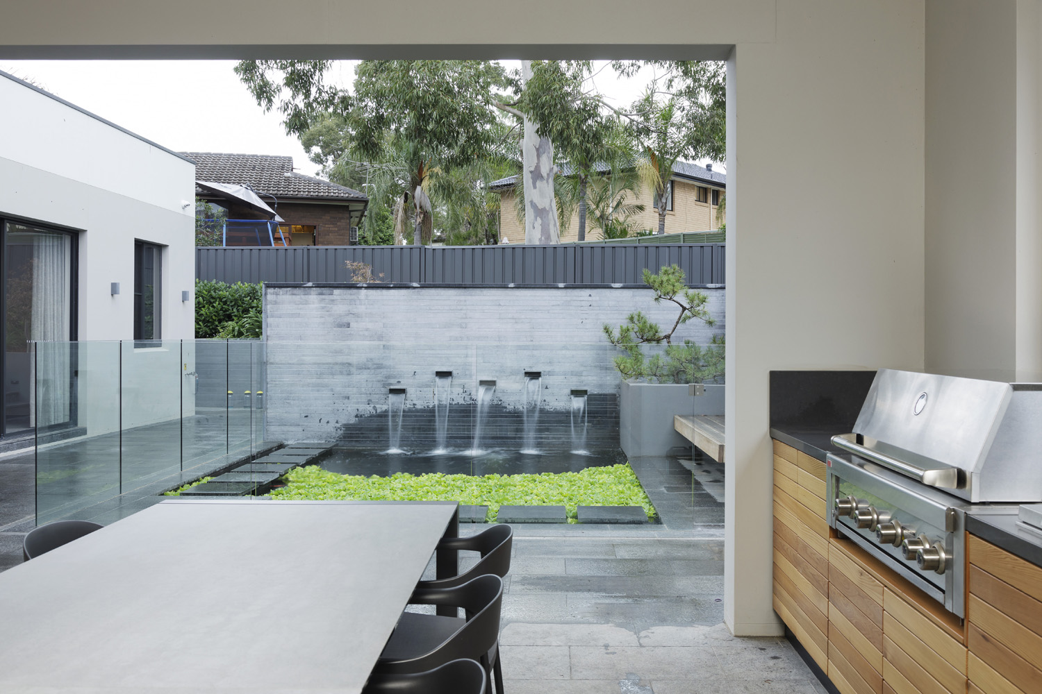 Kings Langley: View from covered outdoor area onto water feature