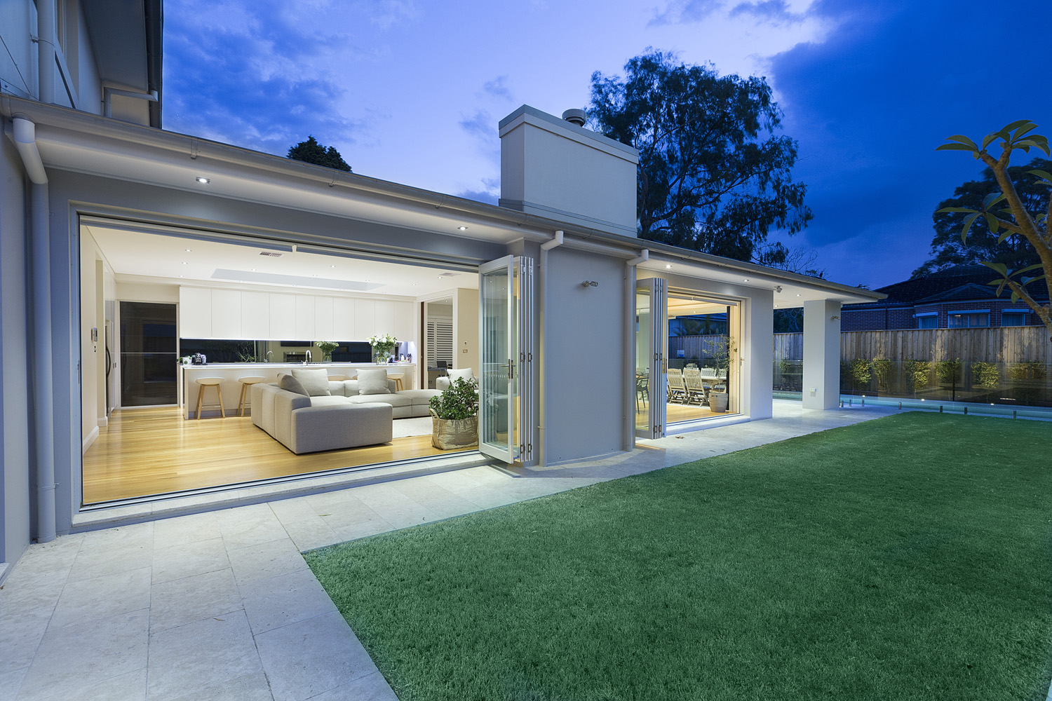 Turramurra Contemporary: View from backyard into living area at dusk